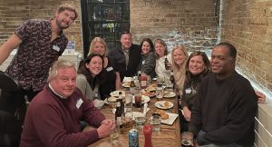 Alexandria City High School Alumni gather round a table at Chadwicks in Old Town, October 2021